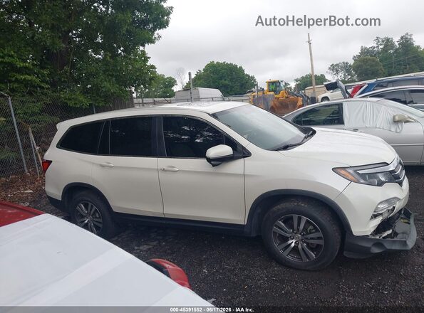 5FNYF5H55JB002327 2018 HONDA PILOT White Սալոնի հետևի տեսք