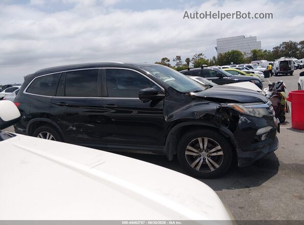 5FNYF5H6XHB018056 2017 HONDA PILOT Black Вид задньої частини салону