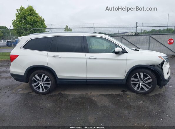 5FNYF6H01HB050072 2017 HONDA PILOT White Rear interior view