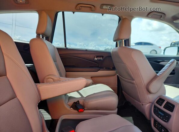 5FNYF6H02JB009553 2018 HONDA PILOT Silver Rear interior view