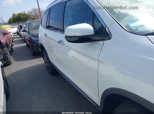 5FNYF6H05LB019884 2020 HONDA PILOT White Rear interior view