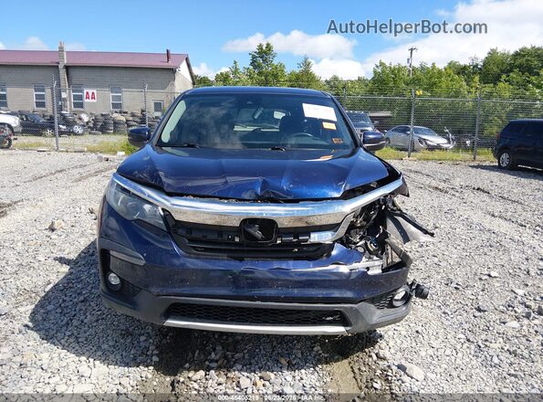 5FNYF6H32KB054519 2019 HONDA PILOT Blue Rear interior view