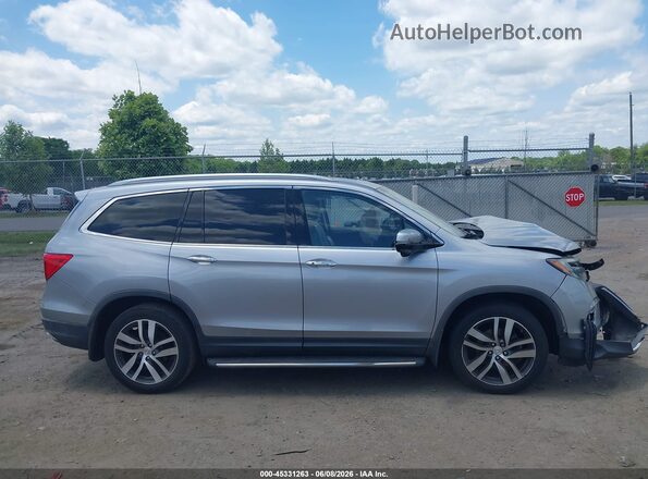 5FNYF6H98JB005649 2018 HONDA PILOT Серебряный Вид задней части салона