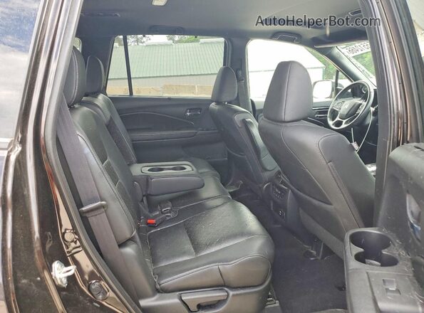 5FNYF8H02KB014104 2019 HONDA PASSPORT Brown Rear interior view