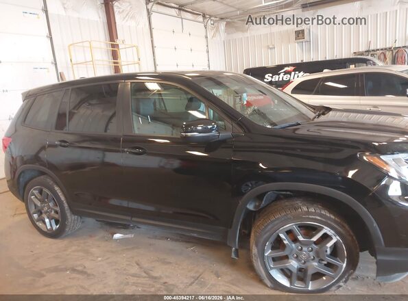 5FNYF8H52PB003980 2023 HONDA PASSPORT Black Вид задньої частини салону