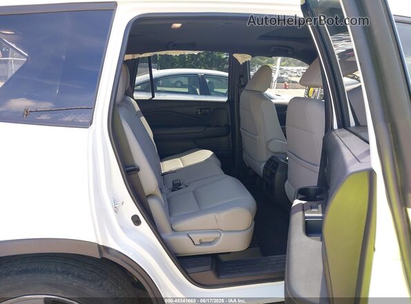 5FNYF8H55NB018678 2022 HONDA PASSPORT White Vista de la etiqueta del VIN