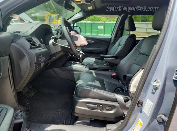 5FNYF8H56PB011631 2023 HONDA PASSPORT Blue Front interior view