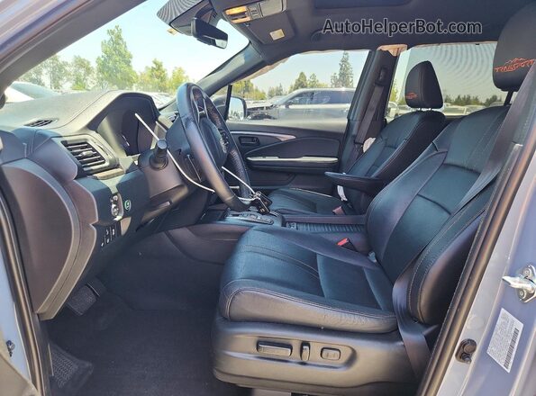 5FNYF8H61PB035893 2023 HONDA PASSPORT Blue Front interior view