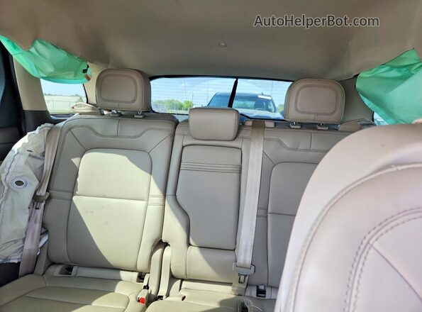 5LMCJ1CA5PUL24304 2023 LINCOLN CORSAIR White Vista de los asientos traseros