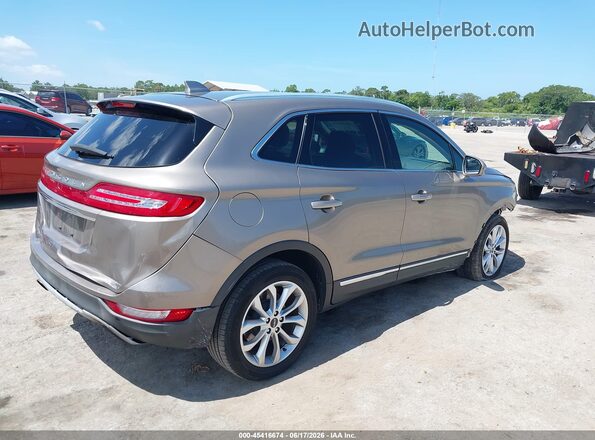 5LMCJ2C90KUL50183 2019 LINCOLN MKC Beige Trasero derecho