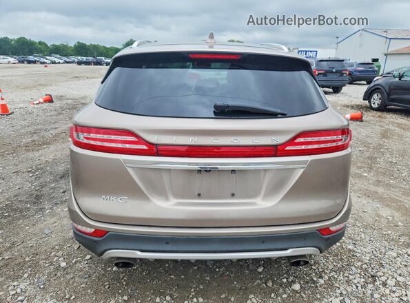 5LMCJ2C91KUL17225 2019 LINCOLN MKC Tan Вид ззаду