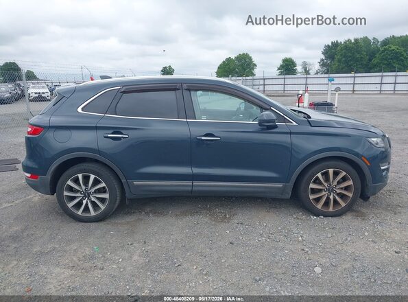 5LMCJ3C94KUL04135 2019 LINCOLN MKC Blue Rear interior view