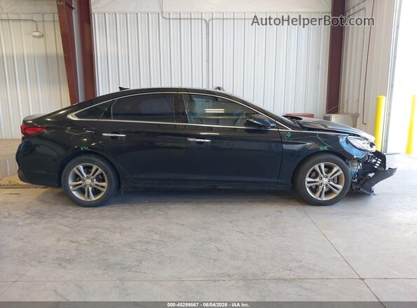 5NPE34AF0JH597596 2018 HYUNDAI SONATA Black Rear interior view