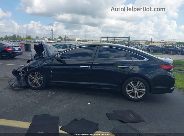 5NPE34AF4KH788102 2019 HYUNDAI SONATA Черный Вид задней части салона
