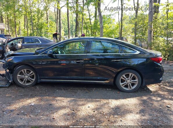 5NPE34AF7JH704966 2018 HYUNDAI SONATA Black Rear interior view