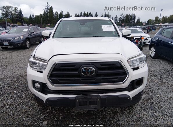 5TFSZ5AN6KX207394 2019 TOYOTA TACOMA Белый Вид задней части салона