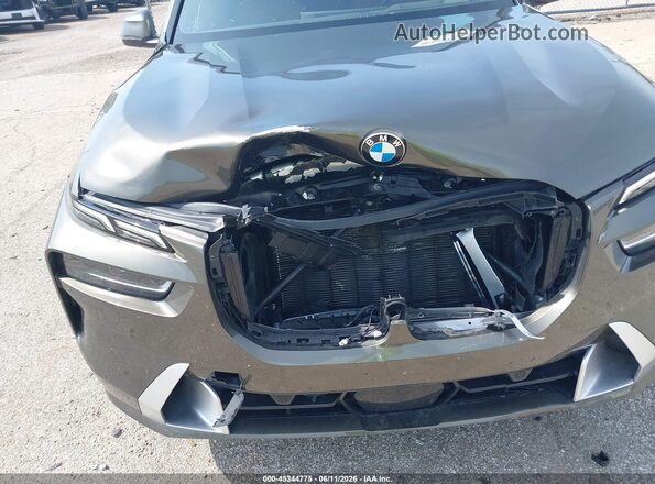 5UX23EM04R9U34971 2024 BMW X7 Коричневый Вид спереди