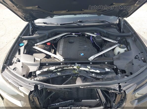 5UX23EM04R9U34971 2024 BMW X7 Коричневый Вид сзади