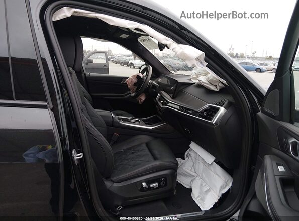 5UX23EM04R9V50607 2024 BMW X7 Black Вид салону спереду