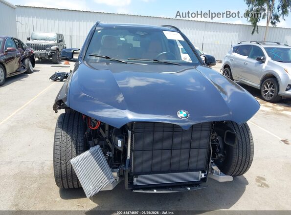 5UX33EU01T9044731 2026 BMW X5 Dark Blue Rear interior view