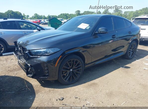 5UX33EX04R9S73070 2024 BMW X6 Black Vista tres cuartos delantera izquierda