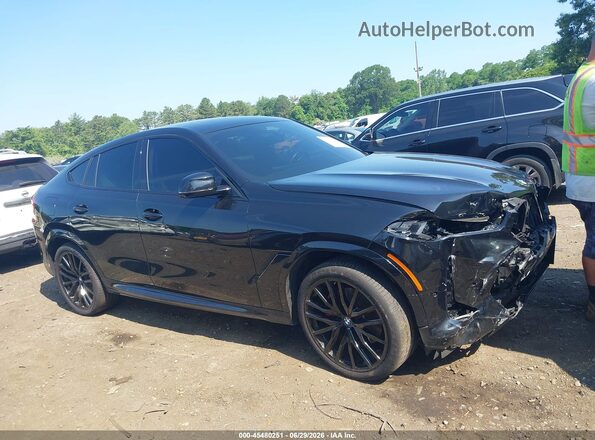 5UX33EX04R9S73070 2024 BMW X6 Black Vista interior trasera