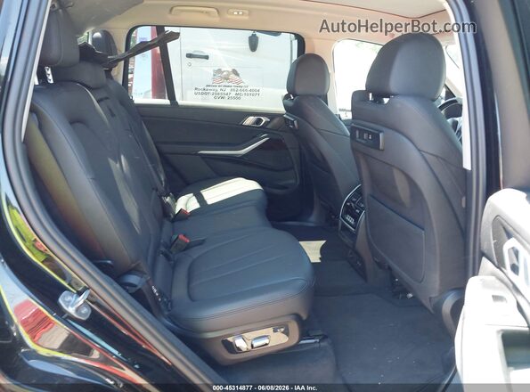 5UXCW2C00L9A02075 2020 BMW X7 Black Vista de la etiqueta del VIN