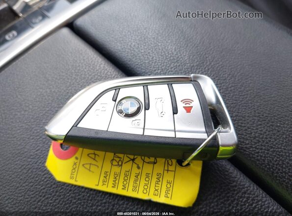 5UXCW2C08L9C16036 2020 BMW X7 Black Առջևի վահանակի տեսք