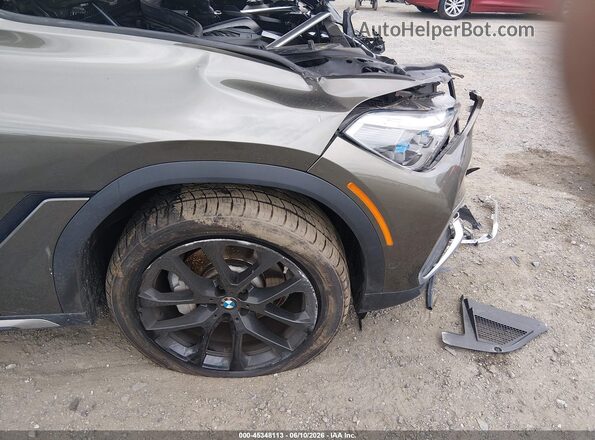 5UXCY6C01M9G93104 2021 BMW X6 Brown Front view