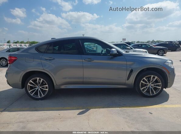 5UXKU0C5XG0F92359 2016 BMW X6 Gray Widok wnętrza z tyłu