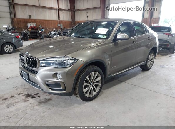 5UXKU2C5XJ0X49520 2018 BMW X6 Tan Առջևի ձախ երեք քառորդ տեսարան