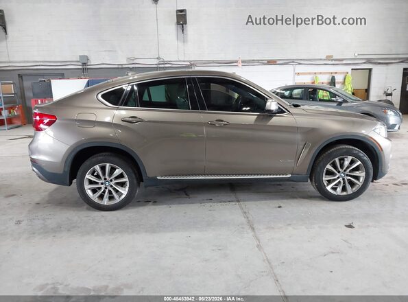 5UXKU2C5XJ0X49520 2018 BMW X6 Tan Սալոնի հետևի տեսք