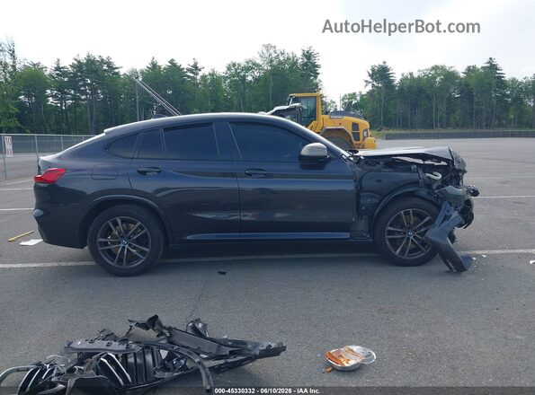 5UXUJ5C56KLJ64209 2019 BMW X4 Серый Вид задней части салона