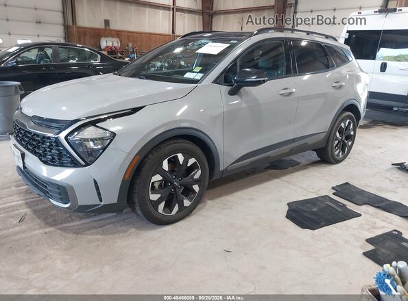 5XYK6CAF9PG034101 2023 KIA SPORTAGE Gray Vista tres cuartos delantera izquierda