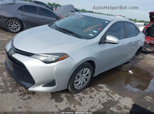 5YFBURHE0KP924660 2019 TOYOTA COROLLA Silver წინა მარცხენა ხედი სამი მეოთხედიდან