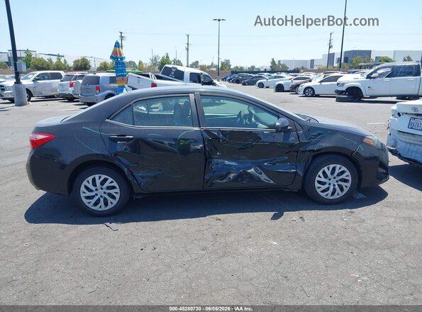 5YFBURHE2JP854223 2018 TOYOTA COROLLA Black Սալոնի հետևի տեսք