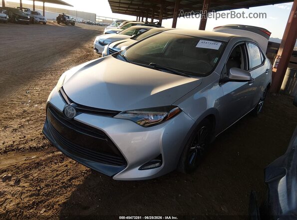 5YFBURHE4HP627559 2017 TOYOTA COROLLA Silver Vista tres cuartos delantera izquierda