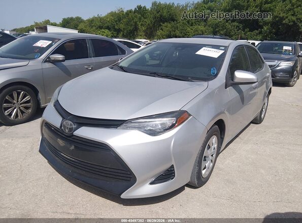 5YFBURHE4KP868691 2019 TOYOTA COROLLA Gray Vista tres cuartos delantera izquierda