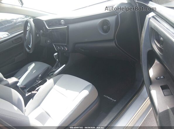 5YFBURHE4KP868691 2019 TOYOTA COROLLA Gray Vista interior delantera