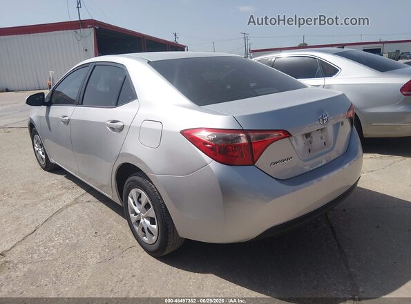 5YFBURHE4KP868691 2019 TOYOTA COROLLA Gray Trasero izquierdo
