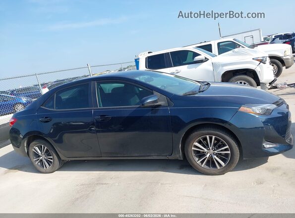5YFBURHE4KP939047 2019 TOYOTA COROLLA Dark Blue Вид задней части салона