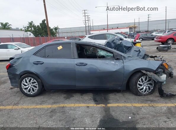5YFBURHE6KP894435 2019 TOYOTA COROLLA Gray Սալոնի հետևի տեսք