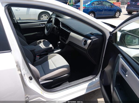 5YFBURHE8KP935650 2019 TOYOTA COROLLA Белый Вид салона спереди