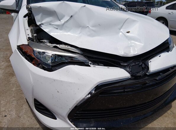 5YFBURHE8KP935650 2019 TOYOTA COROLLA Белый Вид спереди