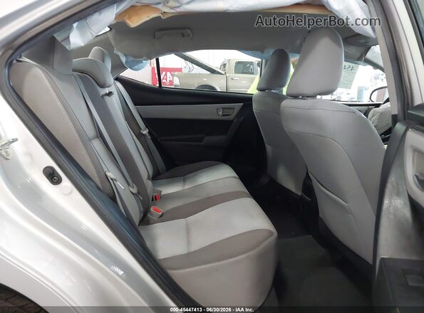 5YFBURHEXJP842563 2018 TOYOTA COROLLA Silver VIN sticker view