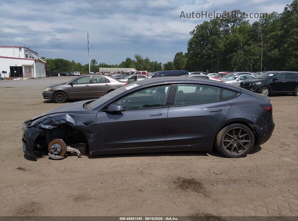 5YJ3E1EB1PF634735 2023 TESLA MODEL 3 Gray Widok wnętrza z tyłu