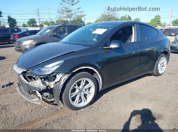 5YJYGDEE7MF257559 2021 TESLA MODEL Y Green წინა მარცხენა ხედი სამი მეოთხედიდან