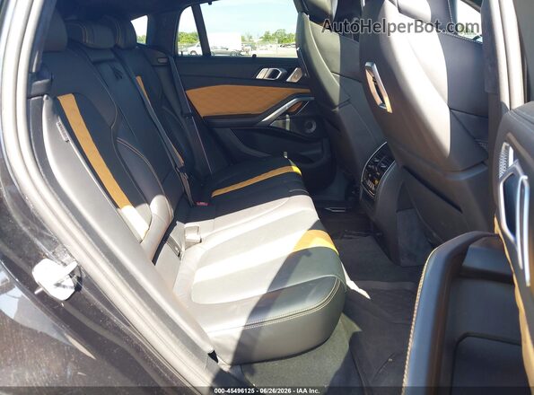 5YM23ET04R9U40182 2024 BMW X6 M Black VIN sticker view