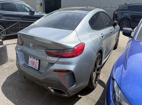WBAGV8C09PCK90335 2023 BMW M8 Gray Front right