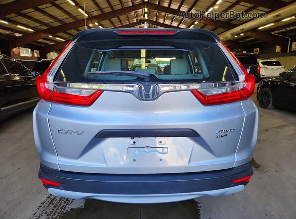 2HKRW6H3XJH201321 2018 HONDA CR-V Серебряный Вид салона спереди